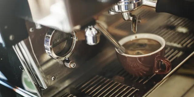 Commercial espresso machine in a cafe setting