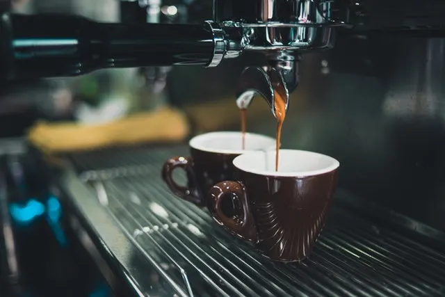 Fresh espresso pouring from a coffee machine